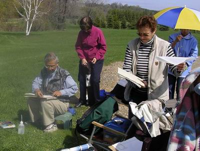 Setting up for painting outdoors means finding a spot for a chair