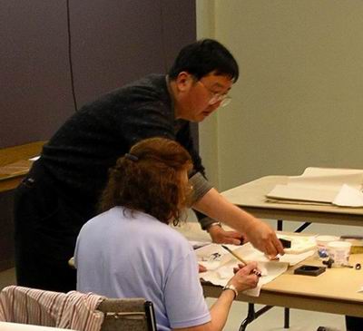 David Hu helps workshop participant.