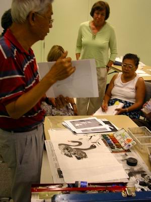 Charles Leung shows other flying swans